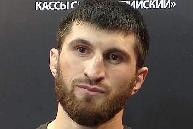 Magomed Ankalaev during an interview at UFC Fight Night 136 in Moscow, with a dark event backdrop.