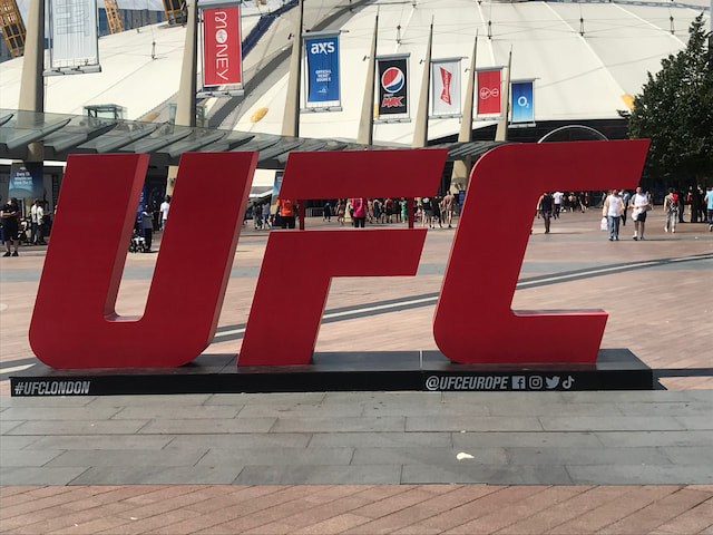 Large red UFC sign outside The O2 Arena in London.